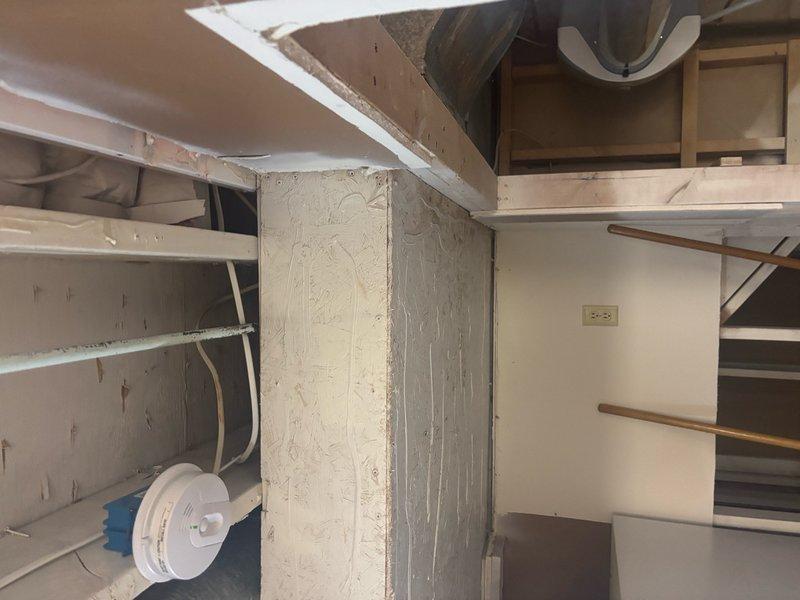 Conducted on-site evaluation for water heater replacement in residential property currently equipped with a commercial-grade tankless unit. Assessed existing installation including gas line connections, venting requirements, electrical wiring, and plumbing configurations in underfloor crawlspace area. Documented copper supply piping, compression fittings, and mounting infrastructure to determine compatibility requirements for both tankless and traditional tank-style replacement options. Evaluated utility space constraints, structural support adequacy, and code compliance considerations for proposed equipment upgrade from commercial to residential-appropriate water heating system.