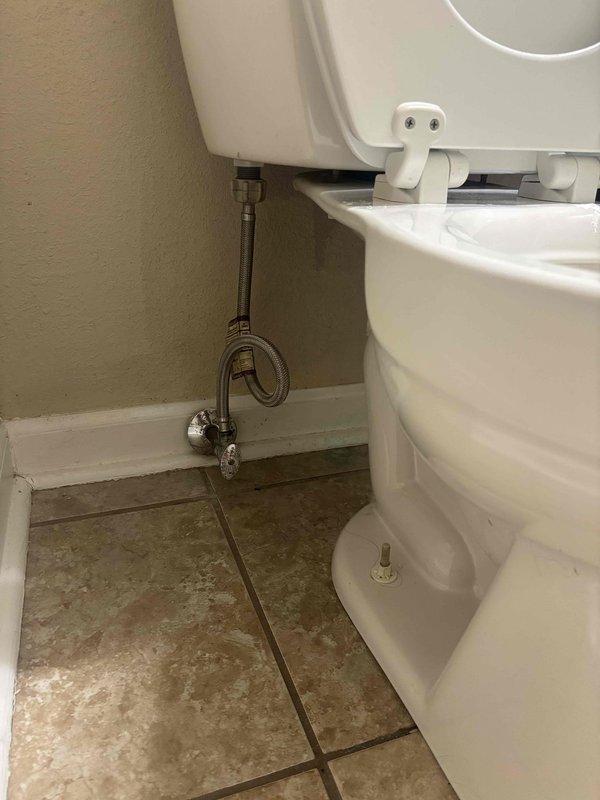 Responded to clogged drain service call and performed toilet removal to access main drain line. Upon inspection, found deteriorated wax ring seal at toilet flange requiring replacement. Removed existing toilet, cleared obstruction from drain opening, and cleaned flange surface. Installed new wax ring seal and reinstalled toilet with proper alignment to flange. Reconnected water supply line to fill valve and tested for leaks. Verified proper flush operation and drainage flow restored to normal function.