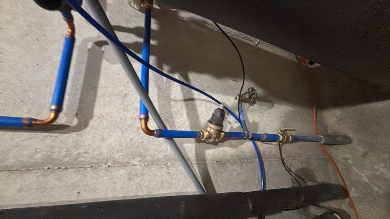 Responded to service call for water heater discharging excessive water in basement. Upon inspection, diagnosed issue with temperature and pressure relief (TPR) valve experiencing continuous discharge. Evaluated existing tanked water heater installation and associated plumbing connections, including PEX water supply lines with copper compression fittings and shutoff valves. Performed necessary repairs to resolve discharge issue and restore proper TPR valve function. Inspected water treatment system with filtration tanks to ensure proper operation and verify no impact on water heater performance. Consulted with homeowner regarding additional faucet replacement request for future service consideration. System tested and verified operational upon completion of repairs.