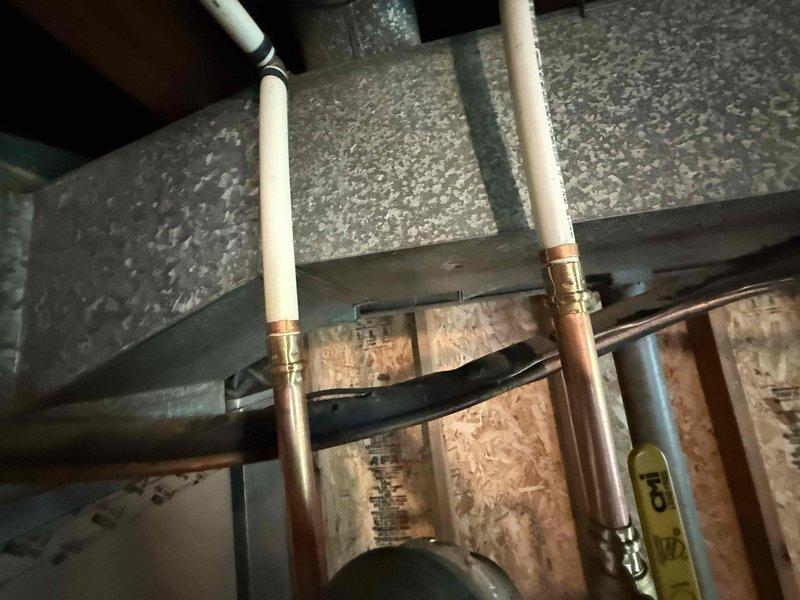 Installed a 40-gallon State brand gas water heater in commercial utility space, replacing existing unit. Connected incoming cold water supply and outgoing hot water distribution lines using copper piping with brass fittings and shutoff valves. Installed blue thermal expansion tank to protect system from pressure buildup due to thermal expansion. Secured all gas connections, verified proper venting through existing ductwork, and ensured compliance with commercial plumbing codes. Tested system operation, confirmed proper ignition, and verified no leaks at all connection points.