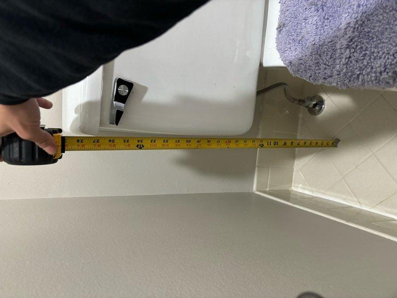Technician responded to master bathroom to provide estimate for replacing existing toilet with Toto Drake model. Performed site assessment including measurements of current toilet dimensions and rough-in spacing to verify compatibility with requested fixture. Documented existing bathroom configuration, tile work, and plumbing connections to ensure proper installation specifications for estimate preparation.