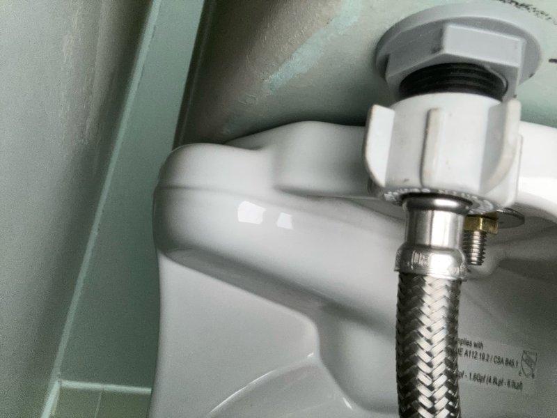 Completed installation of new Toto Drake toilet with fresh wax ring seal. Connected water supply line with braided stainless steel flex connector to ensure reliable water delivery. Verified proper bowl water level, confirmed secure mounting to floor flange, and tested flush operation for optimal performance.