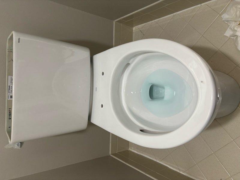 Completed installation of new Toto Drake toilet with fresh wax ring seal. Connected water supply line with braided stainless steel flex connector to ensure reliable water delivery. Verified proper bowl water level, confirmed secure mounting to floor flange, and tested flush operation for optimal performance.