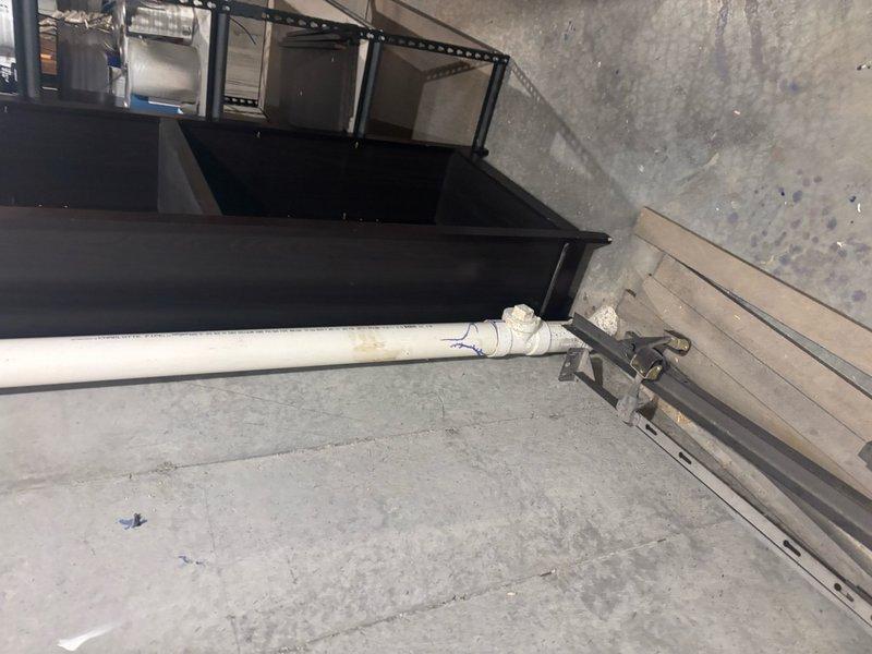 Responded to sewage backup issue in basement shower drain. Upon arrival, found evidence of drainage system blockage causing wastewater to reverse flow through the shower drain fixture. Inspected basement plumbing configuration and identified clog in main drain line. Utilized mechanical augering equipment to clear obstruction from drainage system. Successfully removed blockage and restored proper flow direction. Tested system operation by running water through fixtures to verify complete clearance and proper drainage. Confirmed no additional backflow occurring and all wastewater flowing correctly through main sewer line.