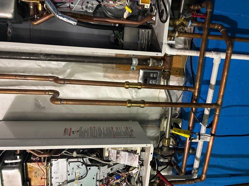 Performed routine maintenance flushes on two tankless water heater units. Addressed Error Code 11 on one unit, which typically indicates ignition failure or inadequate gas flow. Inspected internal components, control boards, heat exchangers, and gas valve assemblies. Verified proper operation of copper supply lines, pressure relief valves, and shut-off valves. Cleaned scale buildup from heat exchanger coils using descaling solution to restore optimal performance. Checked electrical connections, wiring harnesses, and control modules for proper function. Tested gas pressure and flow rates to ensure adequate combustion. Cleared error code and confirmed both units returned to normal operating parameters. Recommended customer renew plumbing maintenance plan for continued service coverage.