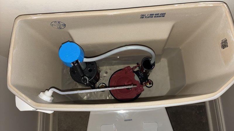 Responded to service call for master bedroom toilet with malfunctioning float assembly. Upon inspection, confirmed fill valve and float mechanism required replacement due to improper water level regulation. Removed toilet tank lid and successfully replaced the defective float assembly with new components, ensuring proper water shutoff at correct fill line. Tested flush cycle multiple times to verify proper operation and water level maintenance. Additionally addressed reported dripping laundry room faucet by inspecting fixture, tightening connections, and replacing worn washers to eliminate leak. All plumbing fixtures restored to proper working order with no further issues detected.