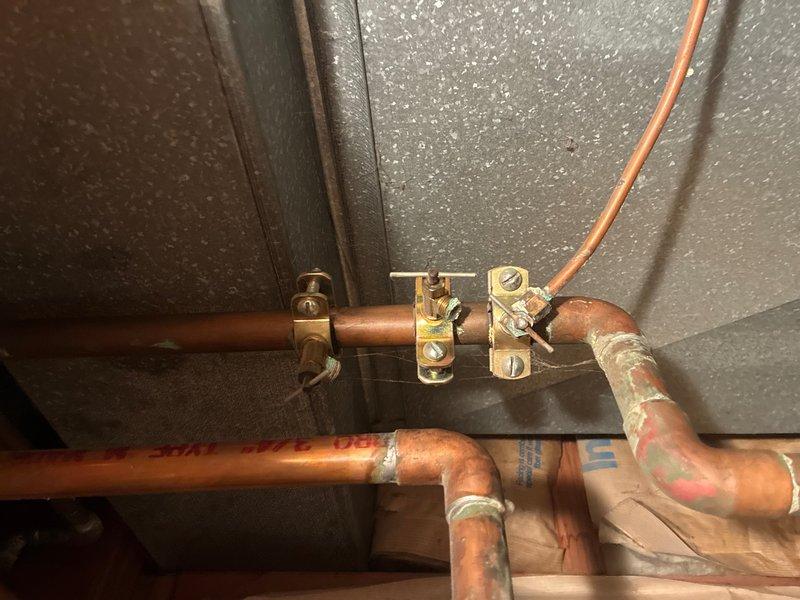 Conducted on-site assessment of existing water heater system and provided estimate for replacement of 40-gallon residential water heater. Evaluated current installation including copper supply lines, electrical grounding components, venting configuration, and connection points to determine scope of replacement work. Documented existing plumbing infrastructure, including brass fittings, shutoff valves, and metallic flue pipe assembly for proper sizing and compatibility with new unit installation.