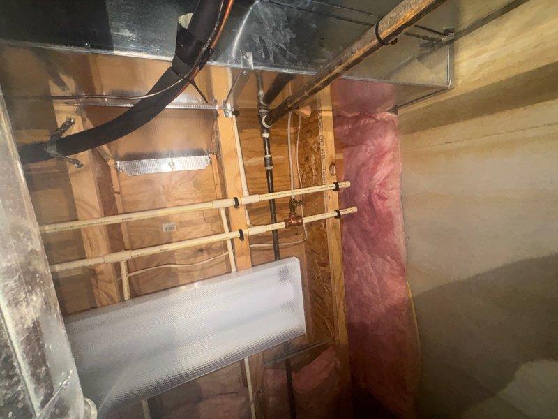 Completed recurring plumbing maintenance inspection in basement crawl space area. Inspected exposed plumbing infrastructure including PVC piping, copper lines, and associated valves and connectors to ensure proper operation and identify any potential issues. All plumbing systems, fixtures, and connections were found to be functioning properly with no leaks or deficiencies noted at this time.