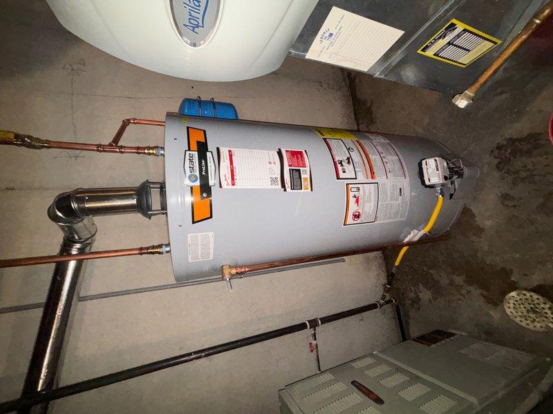 Successfully installed a 75-gallon tall gas water heater in the residential utility room. Removed existing unit, positioned new water heater, and completed all necessary copper piping connections at the top of the unit with proper fittings and configurations. Secured unit with appropriate strapping and mounting hardware per code requirements, verified all gas connections, tested system operation, and confirmed proper functionality of the installation.