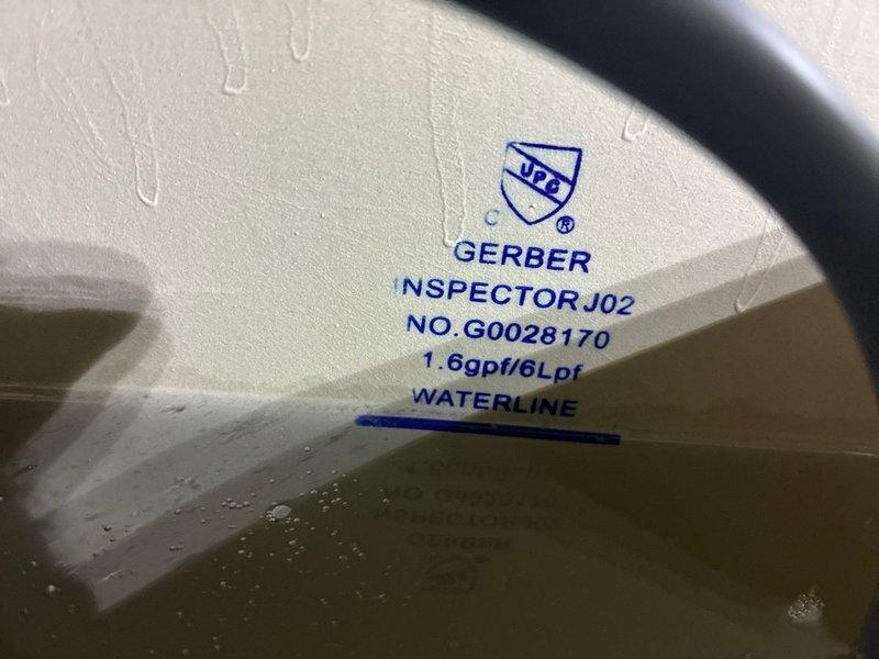 Conducted on-site assessment of commercial Gerber toilet fixtures to provide repair estimate. Inspected toilet tank components including flush valve assembly, flapper mechanism, and internal hardware. Documented existing conditions through photographic evidence showing tank interior, manufacturer specifications (1.6 GPF model), and current operational status for comprehensive estimate preparation.
