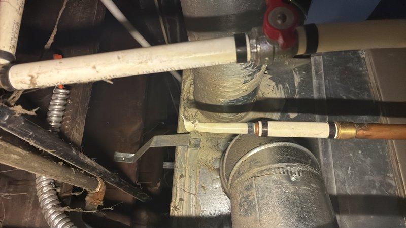 Conducted on-site assessment of existing plumbing system to provide estimate for pipe replacement. Inspection revealed aging water supply lines with visible corrosion, discoloration, and deterioration on exposed piping in bathroom and mechanical areas. Evaluated condition of copper supply lines, brass fittings, shut-off valves, and support structures showing signs of wear and makeshift repairs including metallic tape applications. Documented current state of plumbing infrastructure including floor-mounted toilet fixtures, vertical supply risers, horizontal distribution lines, and associated connections to prepare comprehensive replacement estimate.