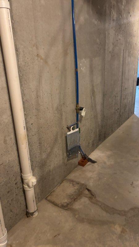 Conducted on-site assessment of unfinished basement utility area to provide water softener installation estimate. Evaluated existing plumbing infrastructure, including vertical PVC drainage lines and electrical service locations along concrete walls. Documented current conditions of installation space, noting available floor area, proximity to existing electrical junction boxes, and accessibility for equipment placement and future maintenance requirements.