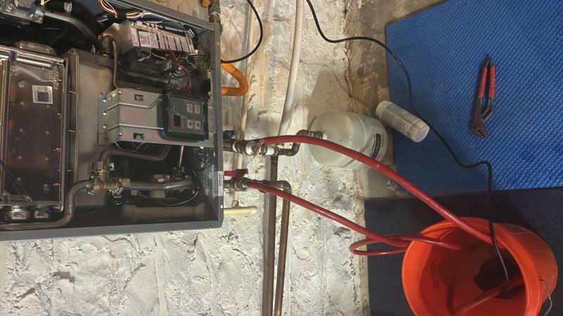 Performed scheduled maintenance on tankless water heater system, completing a comprehensive flush procedure to remove mineral buildup and sediment from the heat exchanger. Unit was isolated using service valves, flushed with descaling solution through circulation pump setup, then rinsed thoroughly to restore optimal heating efficiency and extend equipment lifespan.