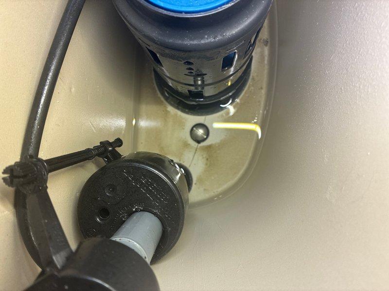 Responded to plumbing repair call for leaking toilet supply line and bathroom faucet. Upon inspection, discovered corroded connection at toilet tank inlet valve with visible water staining and mineral deposits on ceramic fixture and surrounding area. Replaced deteriorated braided stainless steel supply line and brass connection fitting, ensuring proper seal at tank inlet valve. Addressed bathroom faucet leak by inspecting and repairing faulty components. Tested all connections under pressure to verify leak elimination and proper water flow. Photographed damaged components and completed repairs for documentation purposes.