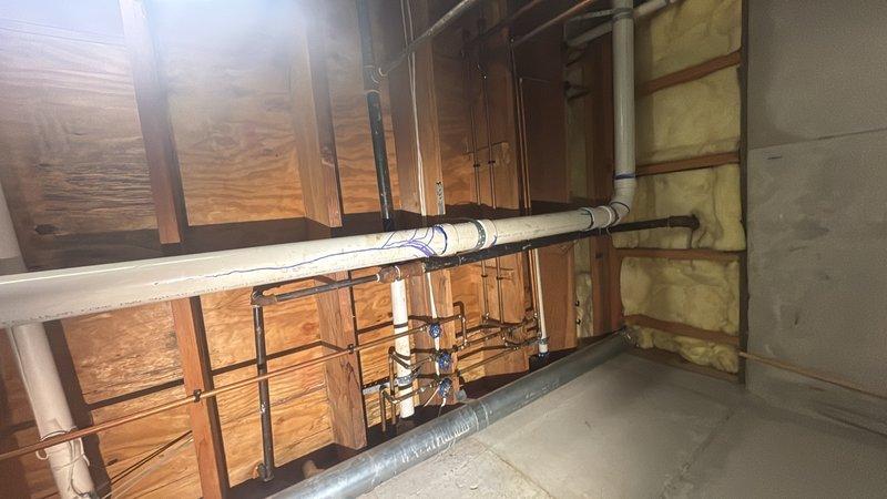Responded to service call for potential gas leak investigation after utility company advised customer to have system inspected due to health concerns and possible carbon monoxide or gas leak. Performed comprehensive gas pressure test on entire system with gas service active. Conducted thorough visual inspection of all accessible gas piping, connections, and appliances throughout property including basement utility area. Utilized gas detection equipment to check for presence of natural gas leaks at all joints, valves, and appliance connections. Inspected exposed gas lines, plumbing infrastructure, and utility systems in unfinished basement areas. No gas leaks detected during pressure testing or visual inspection. All gas piping connections, valves, and fittings tested within normal operating parameters with no pressure loss indicated. Documented findings with photographs of utility room and gas system infrastructure for customer records.