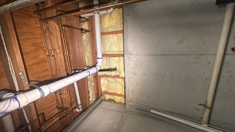 Responded to service call for potential gas leak investigation after utility company advised customer to have system inspected due to health concerns and possible carbon monoxide or gas leak. Performed comprehensive gas pressure test on entire system with gas service active. Conducted thorough visual inspection of all accessible gas piping, connections, and appliances throughout property including basement utility area. Utilized gas detection equipment to check for presence of natural gas leaks at all joints, valves, and appliance connections. Inspected exposed gas lines, plumbing infrastructure, and utility systems in unfinished basement areas. No gas leaks detected during pressure testing or visual inspection. All gas piping connections, valves, and fittings tested within normal operating parameters with no pressure loss indicated. Documented findings with photographs of utility room and gas system infrastructure for customer records.