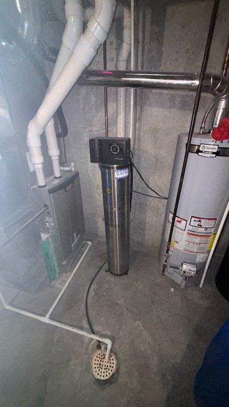 Removed existing water softener system and installed new Matrix MX water treatment unit in basement utility area. Completed all new plumbing hookups to current code specifications, ensuring proper connections to existing water supply lines and drainage system. Delivered and loaded system with two bags of water softener salt for initial operation.