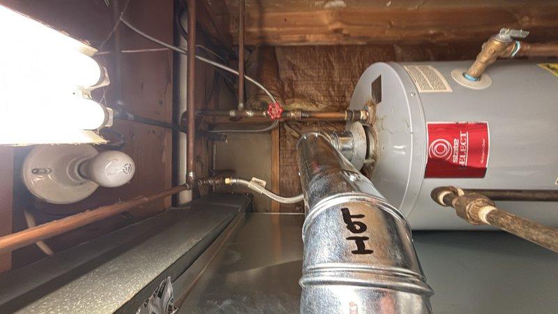 Responded to service call for water heater that would not relight. Upon arrival, inspected gas-fired water heater installation in basement utility area. Examined pilot light assembly, thermocouple, and gas control valve for proper operation. Verified gas supply line connections and tested for adequate gas pressure at the unit. Checked all copper piping connections, pressure relief valve, and shut-off valves for proper installation and function. Successfully restored water heater to operational status and confirmed unit was heating water properly before departure.