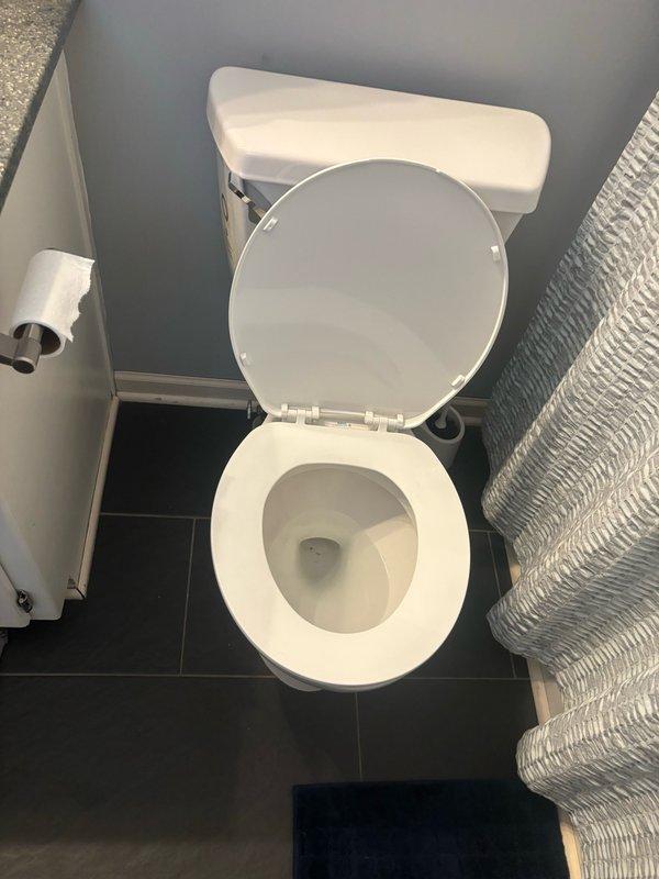 Responded to service call for slow-draining toilet in second-floor guest bathroom that was experiencing near-overflow conditions. Upon arrival, performed diagnostic assessment of toilet drainage system. Utilized plunger to clear blockage in toilet trap and drain line. Successfully restored proper flushing function and drainage flow. Tested toilet multiple times to verify complete resolution of slow drainage issue and confirmed no overflow conditions present. System operating normally upon completion.