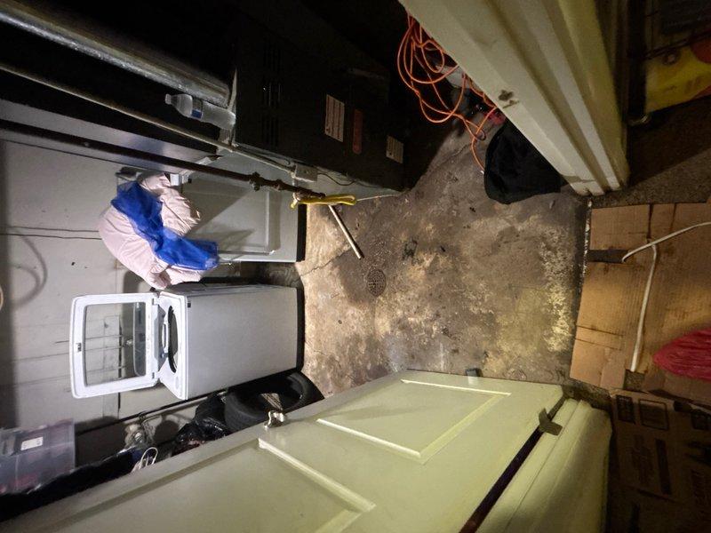 Responded to laundry room drain clog caused by tree root intrusion. Upon arrival, accessed the floor drain in the basement utility area and deployed mechanical cable snake to clear the blockage. Successfully removed root obstruction from the drain line, restoring proper drainage function to the laundry room plumbing system.