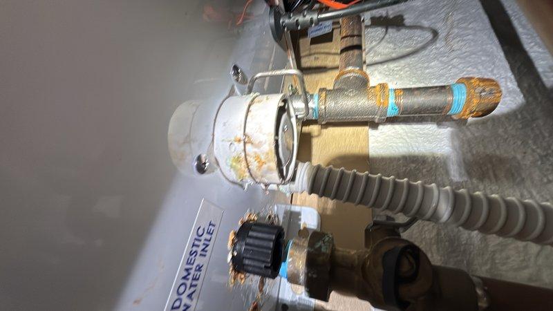Responded to leak investigation request with advance notification. Conducted thorough inspection of water heater system and associated plumbing connections, examining brass valves, copper piping, flexible conduit, and mounting points for signs of active leaks or moisture intrusion. Also inspected HVAC furnace cabinet and internal components including blower motor, heat exchanger, circuit board, and refrigerant lines. Documented all equipment conditions with photographs for service records. No active leaks were identified during the inspection period.