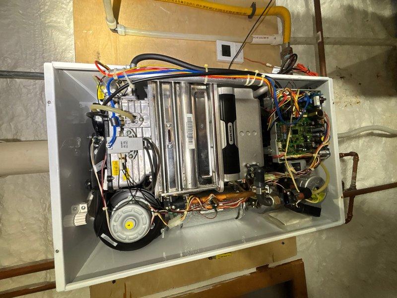 Responded to leak investigation request with advance notification. Conducted thorough inspection of water heater system and associated plumbing connections, examining brass valves, copper piping, flexible conduit, and mounting points for signs of active leaks or moisture intrusion. Also inspected HVAC furnace cabinet and internal components including blower motor, heat exchanger, circuit board, and refrigerant lines. Documented all equipment conditions with photographs for service records. No active leaks were identified during the inspection period.
