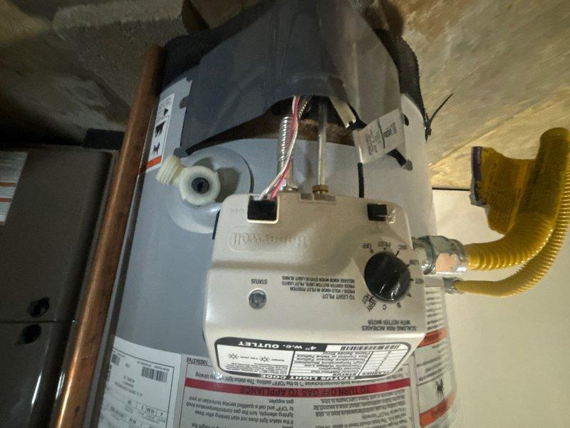 Responded to service call for residential tanked water heater with pilot light failure. Upon inspection, diagnosed and addressed issue with gas control valve assembly preventing pilot ignition. Verified proper gas flow through flexible corrugated gas line connection, cleaned pilot assembly, and successfully relit pilot flame. Tested thermocouple operation and confirmed stable pilot flame retention. Verified all safety controls functioning properly and water heater returning to normal operation with adequate hot water production.