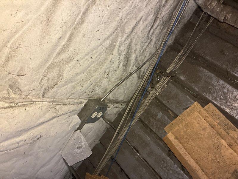 Conducted on-site evaluation for replacement of existing 6-gallon commercial water heater unit located in basement mechanical space. Assessed current installation including electrical connections, plumbing configurations, and mounting arrangement in spray foam insulated area. Documented existing equipment specifications, supply and discharge piping, electrical conduit routing, and structural support conditions. Photographed current water heater with visible manufacturer identification and surrounding utility infrastructure to provide accurate replacement estimate and ensure proper equipment sizing and installation planning.