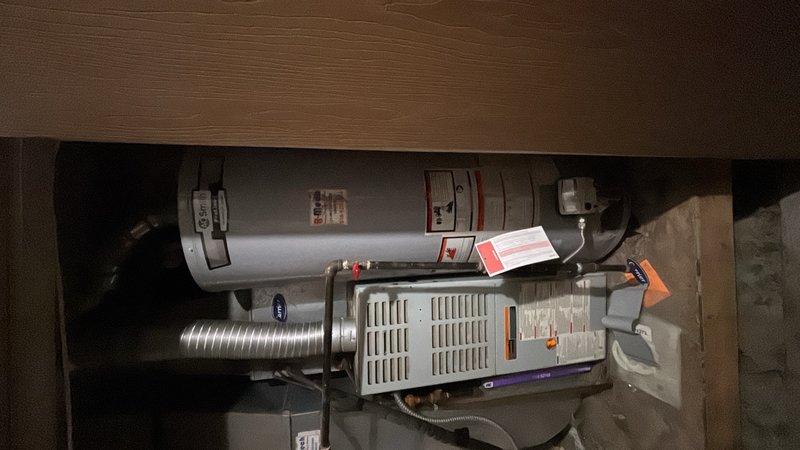Responded to no hot water complaint at residential property. Upon arrival, contacted customer en route as requested. Inspected tanked water heater unit located in garage mechanical room. Diagnosed failed thermocouple preventing pilot light ignition and subsequent burner operation. Replaced faulty thermocouple with new component, ensuring proper positioning in pilot flame. Tested pilot light ignition and verified main burner operation. Confirmed proper gas flow and flame characteristics. Inspected surrounding connections, flex lines, and venting system for any additional issues. System restored to full operational status with hot water production confirmed.