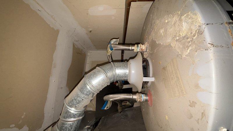 Responded to no hot water complaint at residential property. Upon arrival, contacted customer en route as requested. Inspected tanked water heater unit located in garage mechanical room. Diagnosed failed thermocouple preventing pilot light ignition and subsequent burner operation. Replaced faulty thermocouple with new component, ensuring proper positioning in pilot flame. Tested pilot light ignition and verified main burner operation. Confirmed proper gas flow and flame characteristics. Inspected surrounding connections, flex lines, and venting system for any additional issues. System restored to full operational status with hot water production confirmed.