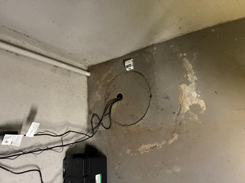 Responded to locked rotor error on existing basement sump pump system. Upon inspection, found multiple float switches and pump components in sump basin with standing water containing sediment and debris. Diagnosed locked rotor condition caused by debris accumulation interfering with pump operation. Cleared obstruction from pump intake, tested float switch operation and pump functionality to ensure proper cycling. Verified discharge system and electrical connections. System restored to normal operation with all components functioning correctly. Recommended periodic maintenance to prevent future debris-related issues.