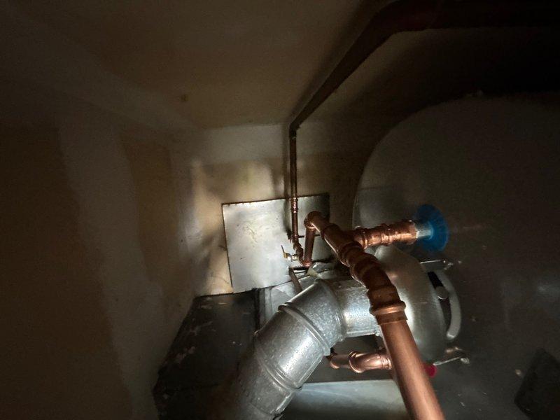 Completed installation of 40-gallon gas-fired water heater with thermal expansion tank in commercial mechanical room. All copper supply and discharge piping was properly connected, pressure relief valve installed per code requirements, and gas line connections verified for safe operation. System was tested and confirmed operational with no leaks detected.