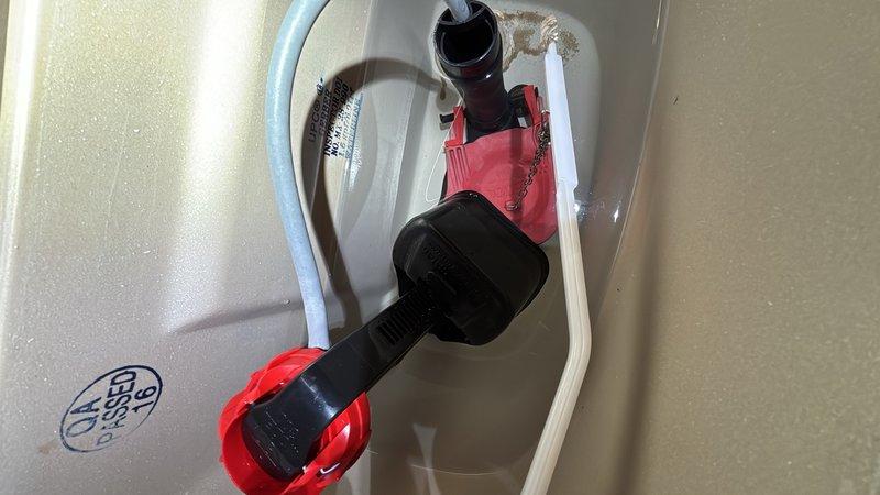 Responded to service call for continuously running toilets on main and lower levels. Performed diagnostic inspection of both toilet flush mechanisms using inspection camera to identify faulty components. Found deteriorated flush valve assemblies with pink plastic components causing constant water flow. Replaced defective flush valves and internal tank mechanisms on both toilets to restore proper operation and eliminate continuous running condition.