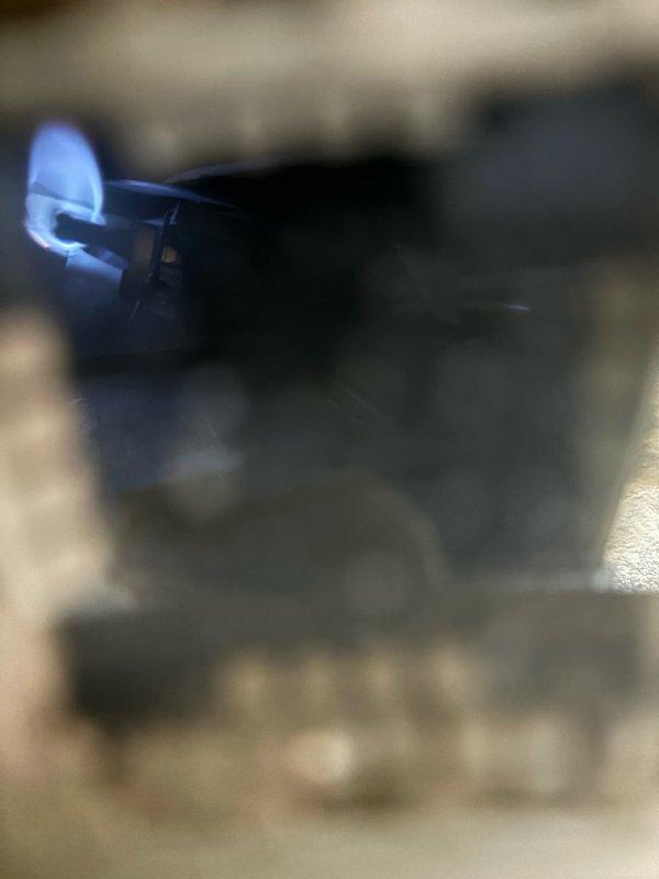 Responded to service call for 14-year-old tanked water heater with non-functioning pilot light in basement installation. Upon inspection, attempted to relight pilot assembly but unit failed to maintain flame. Given the age of the water heater and failed ignition system, recommended replacement due to end of serviceable life expectancy. Documented existing copper supply line connections, pressure relief valve assembly, and expansion tank configuration for future reference. Unit showed typical wear patterns consistent with age, including patina on copper fittings and connections.