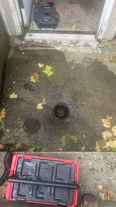 Responded to clogged backyard drain following heavy rainfall. Upon inspection, located drainage system with multiple PVC and metal piping connections showing signs of water accumulation and debris blockage. Cleared obstruction from outdoor drain covers and verified proper water flow through the system. Inspected interior plumbing connections in utility area to ensure no backup or secondary blockages in the drainage line. System restored to normal operation with proper drainage confirmed.