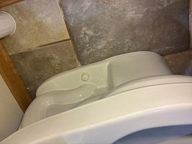 Removed and reset toilet to address reported seal issue. Pulled toilet from floor flange, removed old wax ring, and inspected flange for damage. Installed new wax ring seal and properly repositioned toilet, ensuring secure mounting and proper alignment with drain opening. Verified leak-free operation upon completion.