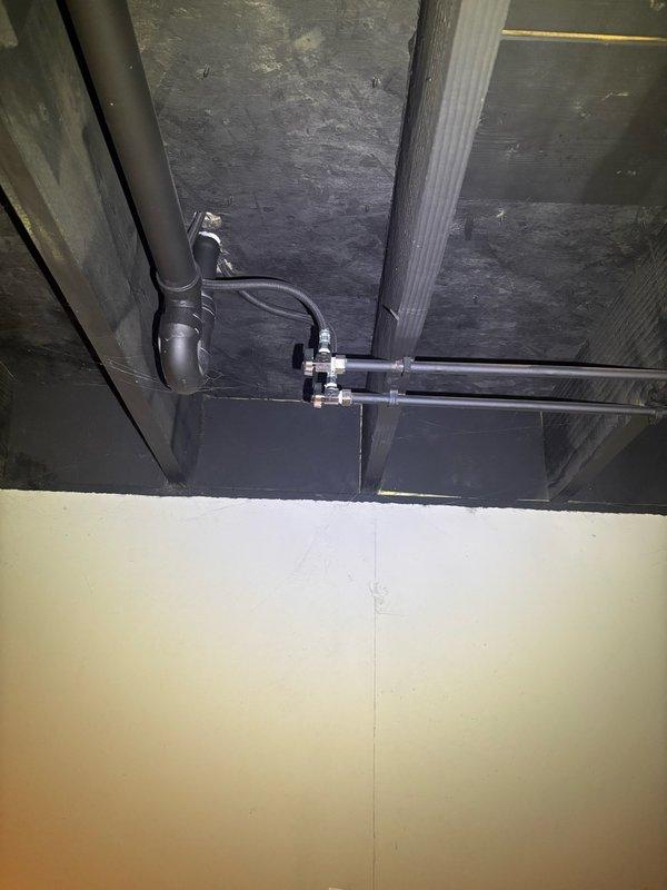 Completed complimentary plumbing inspection of residential property, examining exposed plumbing infrastructure in basement and ceiling cavity areas. Inspected PVC drain lines, vent piping, and copper supply lines for proper installation, support, and condition. Provided detailed estimate for installation of new exterior hose spigot at rear of residence, including routing copper supply line from existing plumbing system, installing shut-off valve, penetrating exterior wall, and mounting freeze-proof sillcock with proper pitch for drainage.
