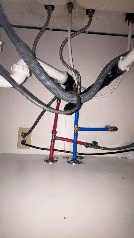 Responded to kitchen sink drain stoppage in 37-year-old residence with basement access. Upon arrival, confirmed clog location previously identified by homeowner and assessed that proper drain clearing equipment would be required. Accessed drain system from basement, utilizing professional drain auger to clear obstruction from kitchen sink line. Successfully removed blockage and restored full drainage flow. Tested system operation with water flow to verify complete clearance and proper drainage function. Inspected under-sink plumbing connections, garbage disposal unit (model E101), P-trap assembly, and supply line shut-off valves to ensure no secondary issues or leaks present. All components functioning properly upon completion.