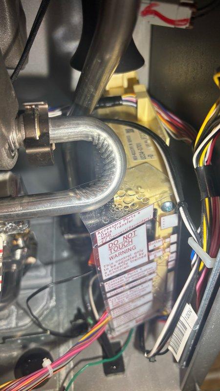 Responded to reported leak from top of tankless water heater unit in basement. Upon inspection, identified leak originating from pressure relief valve and associated plumbing connections. Tightened brass fittings, inspected internal components and pipe connections, and verified proper sealing of all mounting hardware. Unit tested and confirmed no further leakage present upon completion.