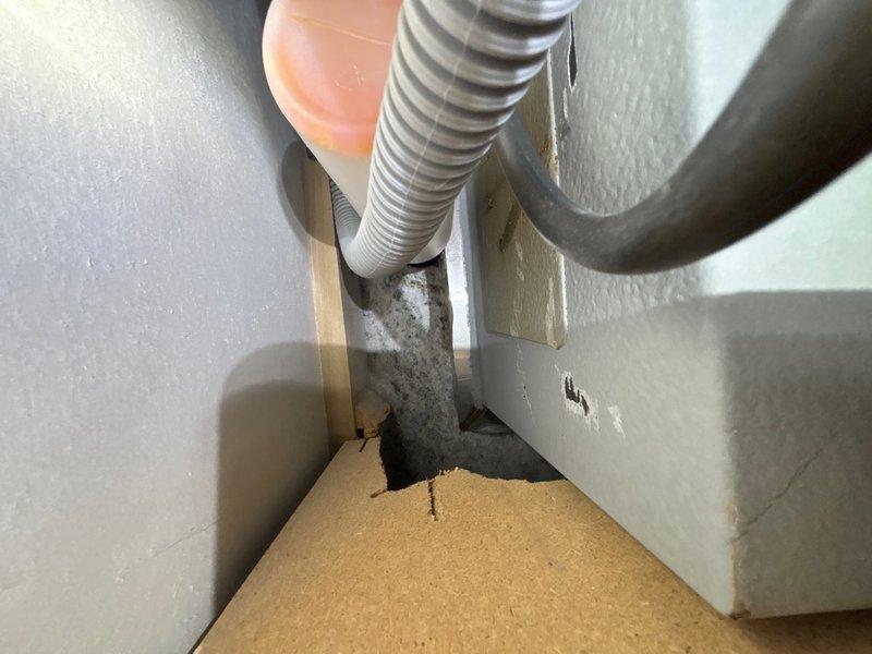 Responded to service call for leak under kitchen sink. Upon arrival, conducted thorough inspection of cabinet interior and plumbing connections. Located source of moisture at supply line connection point beneath sink basin. Identified loose compression fitting on cold water supply line allowing water seepage. 

Tightened compression nut to manufacturer specifications using appropriate wrenches. Inspected additional plumbing connections including P-trap assembly and hot water supply line for potential issues. Verified all connections were secure and properly sealed. Cycled water supply on and off multiple times while monitoring for any signs of leakage. Confirmed repair was successful with no visible moisture or dripping present. Documented conditions with photographs for service records. Left work area clean and dry with all plumbing fixtures functioning properly.