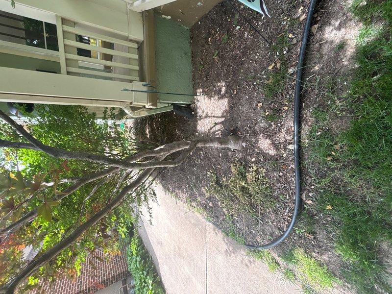 Responded to service call for sump pump reported as not operating correctly in basement. Upon inspection, verified existing sump pump functionality and assessed discharge line routing from basement to exterior. Confirmed discharge line was properly positioned and draining away from foundation, with hose extending across concrete walkway into landscaped area. System tested and operating within normal parameters at time of service completion.