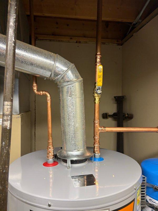 Successfully installed a 50-gallon gas-fired water heater in the residential basement utility area. Completed all copper supply line connections with hot and cold water piping, installed gas line with shutoff valve, and ensured proper venting integration with existing HVAC ductwork. Unit tested and verified operational with all connections leak-free and gas valve functioning properly.