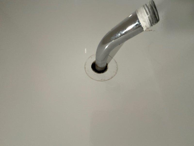 Responded to water leak from shower hot and cold supply lines in basement. Upon inspection, identified significant corrosion and deterioration at pipe penetration points through ceiling surface. Repaired leaking shower supply lines, addressed corroded pipe connections, and secured proper sealing at fixture stub-out to prevent further water intrusion.