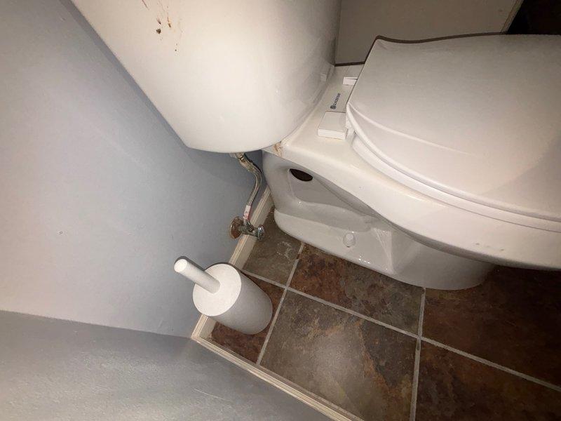 Completed installation of customer-supplied toilet in bathroom. Removed existing fixture and installed new two-piece toilet with wax ring seal to ensure proper connection to the waste flange. Connected chrome water supply line from wall shut-off valve to toilet tank fill valve, verified all connections for proper seal and function, and tested for leaks. Toilet is operational and ready for use.