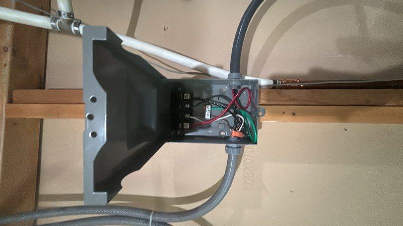 Completed installation of a 50-gallon electric water heater with thermal expansion tank and ball valve shut-off in basement utility area. Installed secondary electrical disconnect box with proper conduit routing to provide code-compliant power shutoff for the water heater circuit. All copper supply lines, electrical connections, and safety components were properly secured and tested for operation.