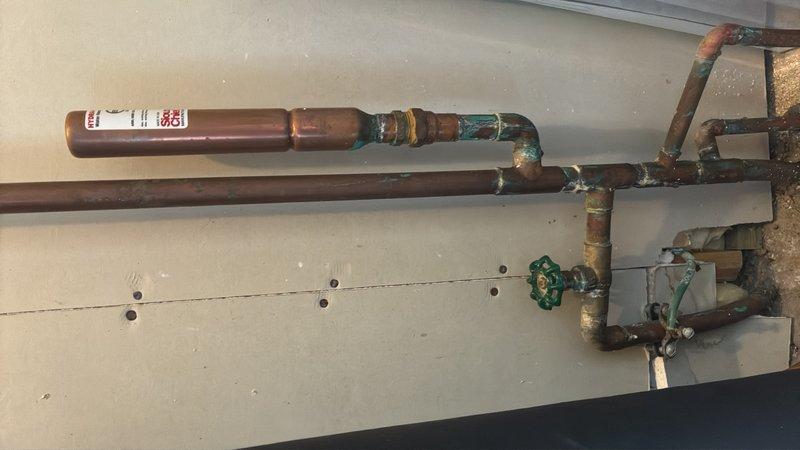 Completed comprehensive plumbing estimate for pressure reducing valve (PRV) installation on existing aged copper piping system. Assessed current pipe configuration, existing corrosion patterns with extensive verdigris formation on joints and fittings, and evaluated optimal placement for PRV integration into the water distribution system to regulate incoming water pressure and protect downstream fixtures and appliances.
