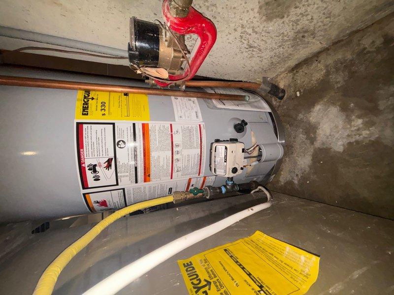 Installed new AO Smith 50-gallon tanked water heater in finished basement, including all necessary copper and PVC plumbing connections, pressure relief valve with discharge line, and proper venting. Additionally, repaired malfunctioning outside faucet where valve stem was seized and unable to unscrew, restoring full operational functionality to exterior water supply.