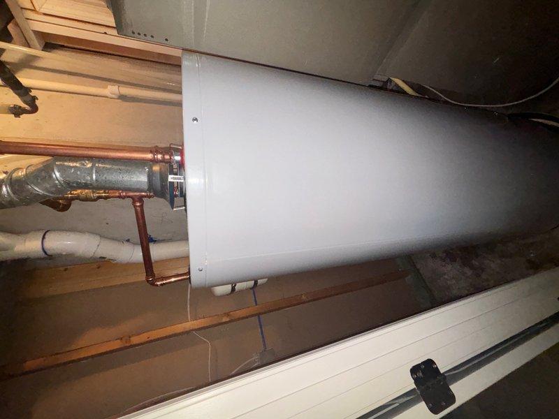 Installed new AO Smith 50-gallon tanked water heater in finished basement, including all necessary copper and PVC plumbing connections, pressure relief valve with discharge line, and proper venting. Additionally, repaired malfunctioning outside faucet where valve stem was seized and unable to unscrew, restoring full operational functionality to exterior water supply.