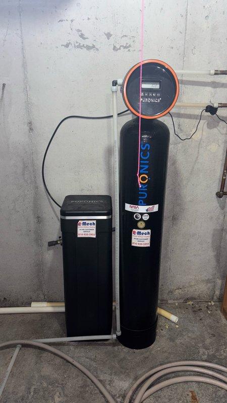 Responded to service call for water heater anode rod replacement assessment. Upon arrival, performed thorough inspection of existing tanked water heater system and surrounding mechanical equipment. Evaluated anode rod condition and accessibility to determine feasibility of replacement versus full unit replacement. Documented current system configuration including water treatment equipment (water softener and filtration system) and HVAC ductwork present in utility space. Noted deteriorated insulation on adjacent ductwork requiring attention. Assessed water heater age, condition, and performance parameters to provide comprehensive evaluation for repair versus replacement recommendation. Captured photographic documentation of existing equipment and installation conditions for customer review and estimate preparation.