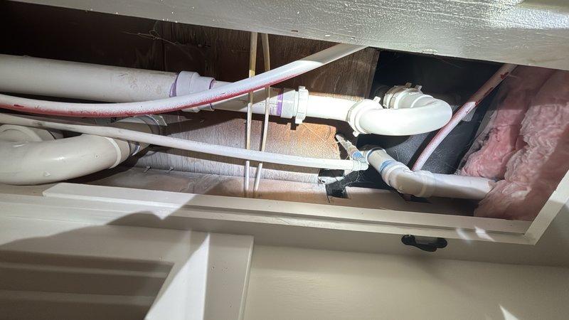 Replaced defective 2-inch P-trap assembly beneath bathroom sink with new PVC P-trap and fittings. Removed old trap configuration, cleaned drain connections, and installed new trap to proper code specifications. Verified proper drainage flow and sealed all connections to prevent leaks. All plumbing components are now functioning correctly with no drainage issues.